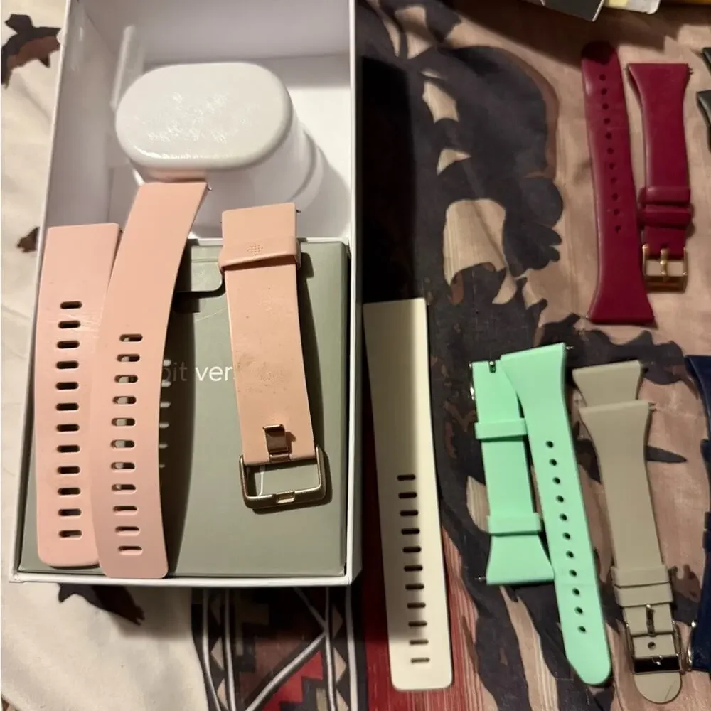 Pair of Fitbit Versa and Fitbit Versa 2, 2 chargers, 2 screen protectors, bands